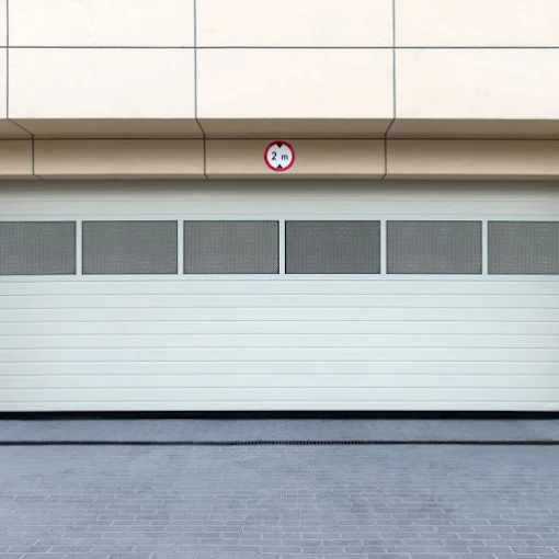 Commercial sectional door with tinted window row